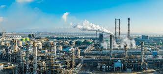 Oil drilling crew positioning iron pipes at North Sea platform - Expert team extracting crude oil for investor returns